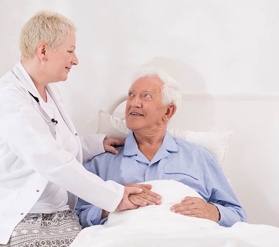 Specialist-talking-to-patient-after-enlarged-prostate-treatment